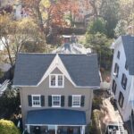 Finished residential roofing project in Flourtown, PA featuring GAF Weatherwood shingles and a Versico rubber flat roof.