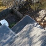 Close-up of a newly installed Versico fully adhered EPDM flat roof system by Nealman Construction.