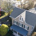 Finished residential roofing project in Flourtown, PA featuring GAF Weatherwood shingles and a Versico rubber flat roof.