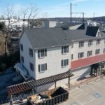 New GAF Timberline HDZ Charcoal shingle roof and VELUX skylights on commercial property in Fort Washington PA by Nealman Construction