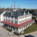 New GAF Timberline HDZ Charcoal shingle roof and VELUX skylights on commercial property in Fort Washington PA by Nealman Construction
