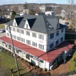 New GAF Timberline HDZ Charcoal shingle roof and VELUX skylights on commercial property in Fort Washington PA by Nealman Construction